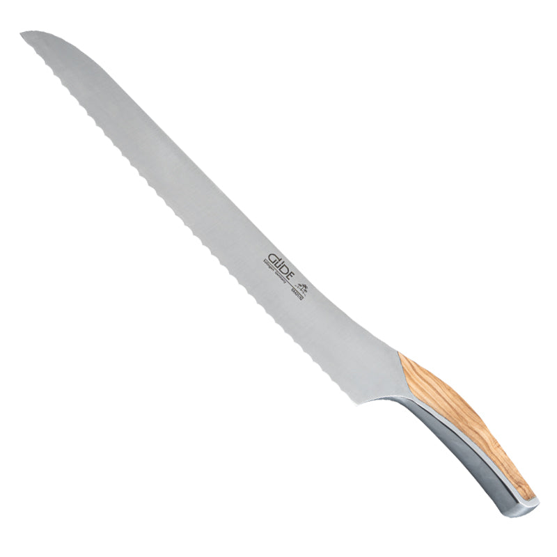 Durchgeschliffen aus einem Stück Stahl: Brotmesser SYNCHROS von Güde Messer Solingen mit traditionellem Wellenschliff, konvexer Griff mit Schalen aus Olivenholz oder Räuchereiche im Online-Shop Home-and-Kitchen.de
