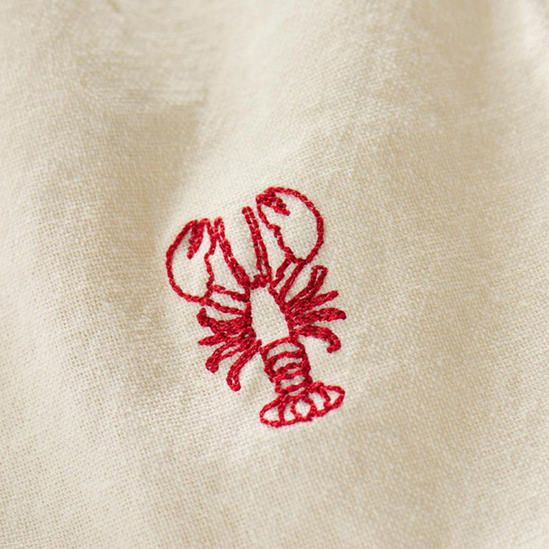 Stoffserviette in Farbe butter-cream, Serie Atlantis, mit aufgesticktem Hummer in rot, 40x40 cm, 40 Grad waschbar
