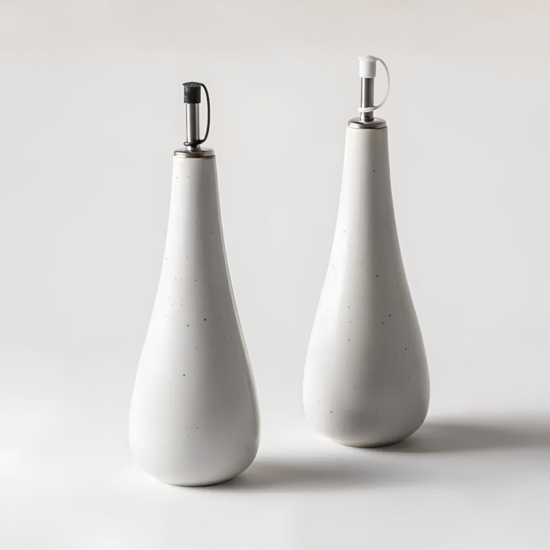 Ladelle Essig und Öl-Set NESTLE in weiße Keramik mit grauen Sprenkeln, unterschiedliche Verschlüsse in Weiß und Schwarz, spülmaschinengeeignet, von Designer Graham Jowitt