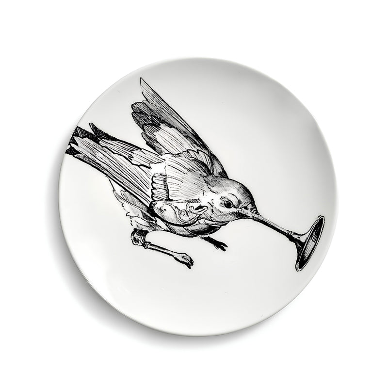 Brotteller UNITY mit Vogel. Er hat einen Durchmesser von 12 cm und eine Höhe von 1 cm und ist von Serax. 